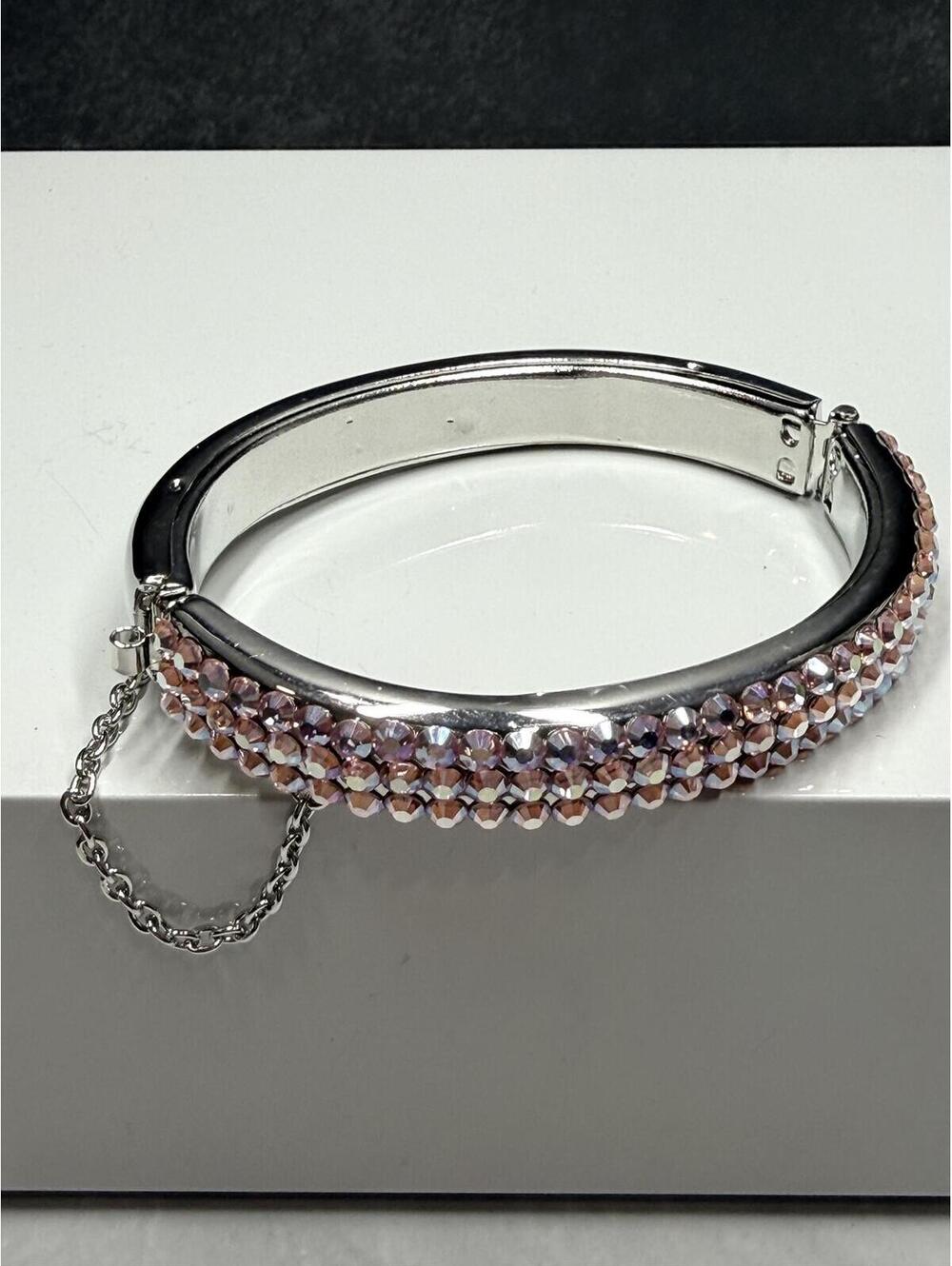 Silver Tone Bangle Bracelet with Pink Rhinestone Accents and Safety Chain